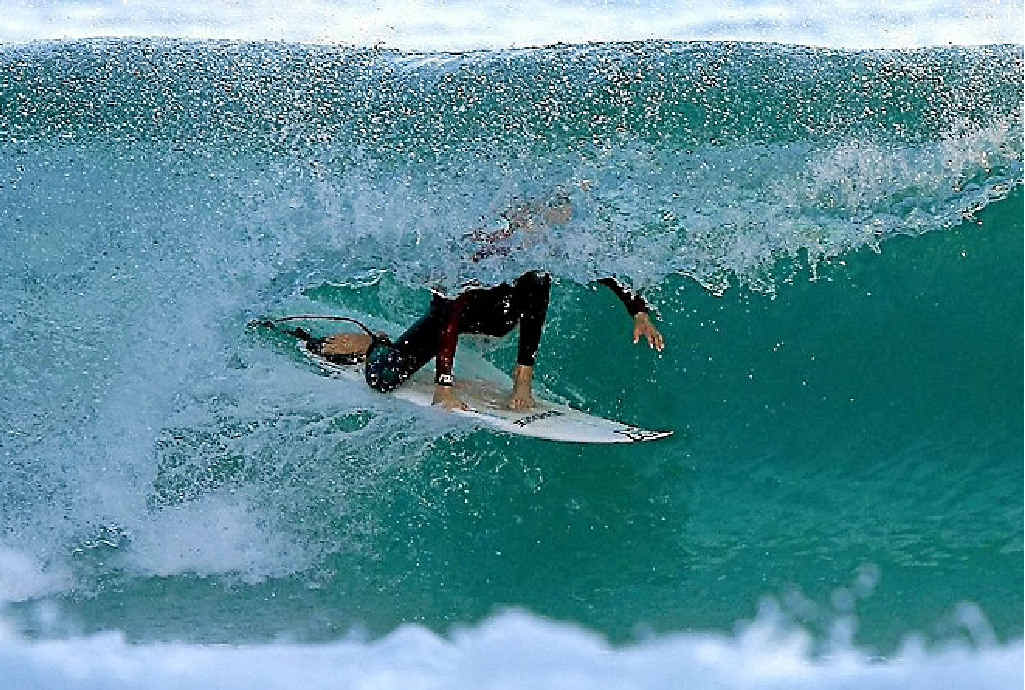 Local grom Kian getting some cover this week. Local grom Kian getting some cover this week.